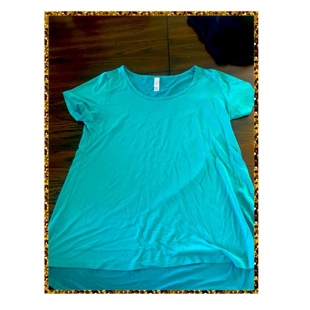 Aqua blue shirt. Material is very soft perfect for the gym or everyday wear.